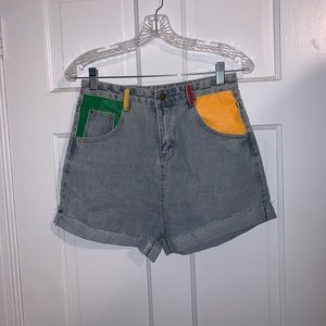 High waisted jean shorts with painted pockets.